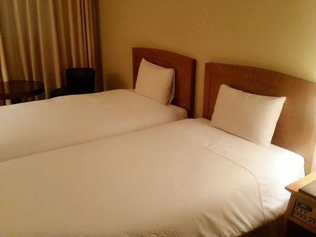 Daedong Hotel Jeju Quarto foto